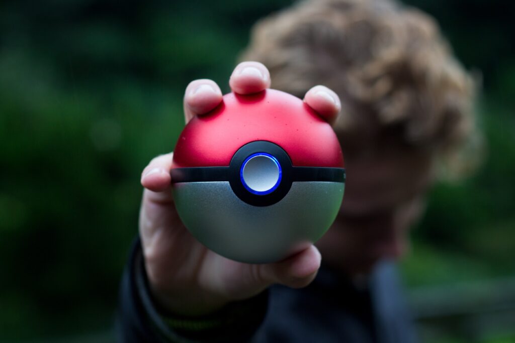 person holding pokemon ball
