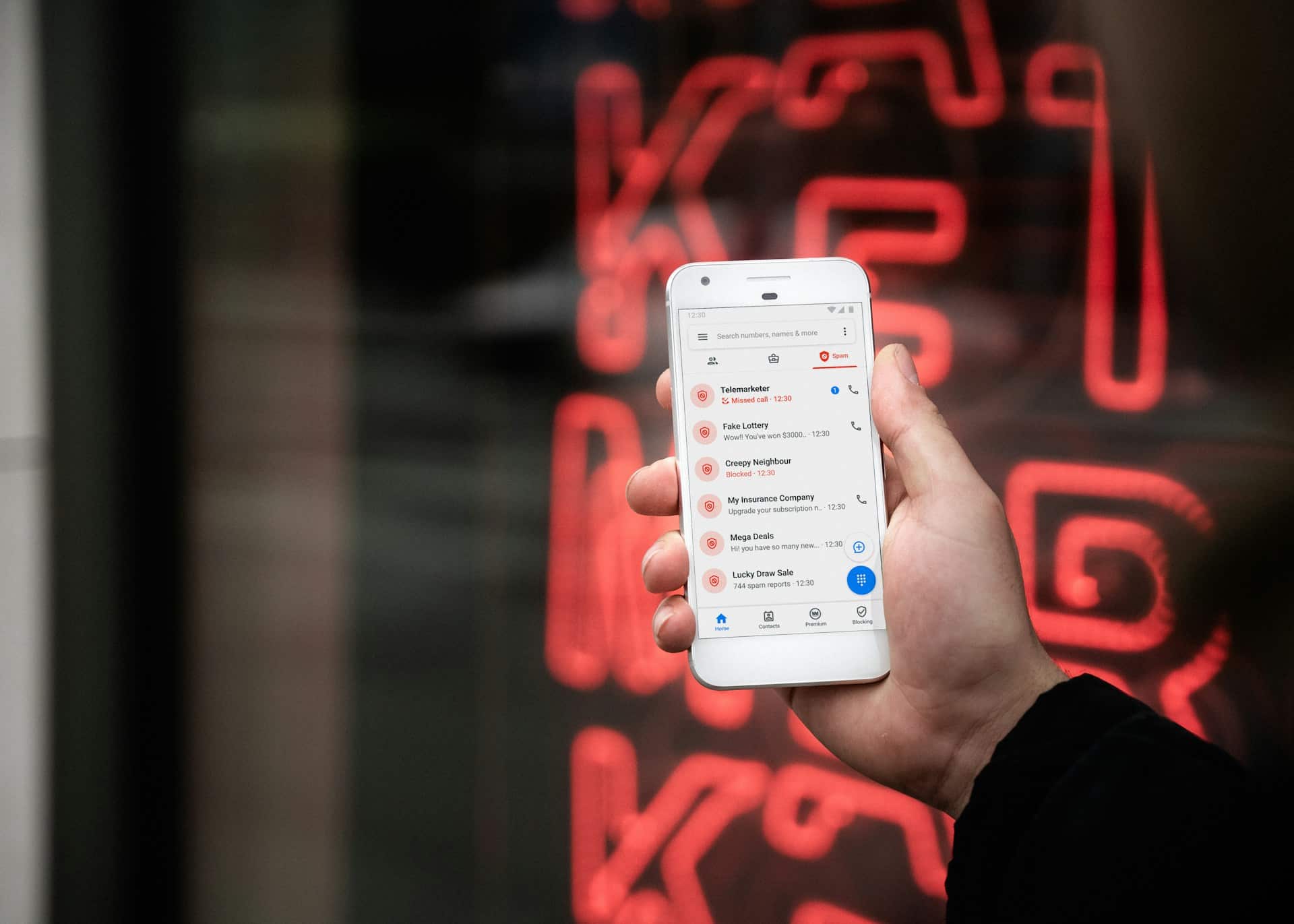 A business professional receiving a branded call from a verified business number.
