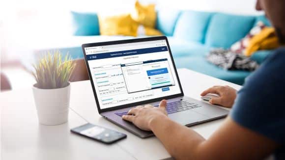 Patient using a healthcare portal on a laptop for appointment scheduling and communication, highlighting Towner’s HIPAA-compliant contact center and engagement tools for Kansas City providers