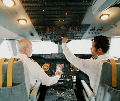 Two pilots working together in a cockpit representing Microsoft Copilot and business collaboration