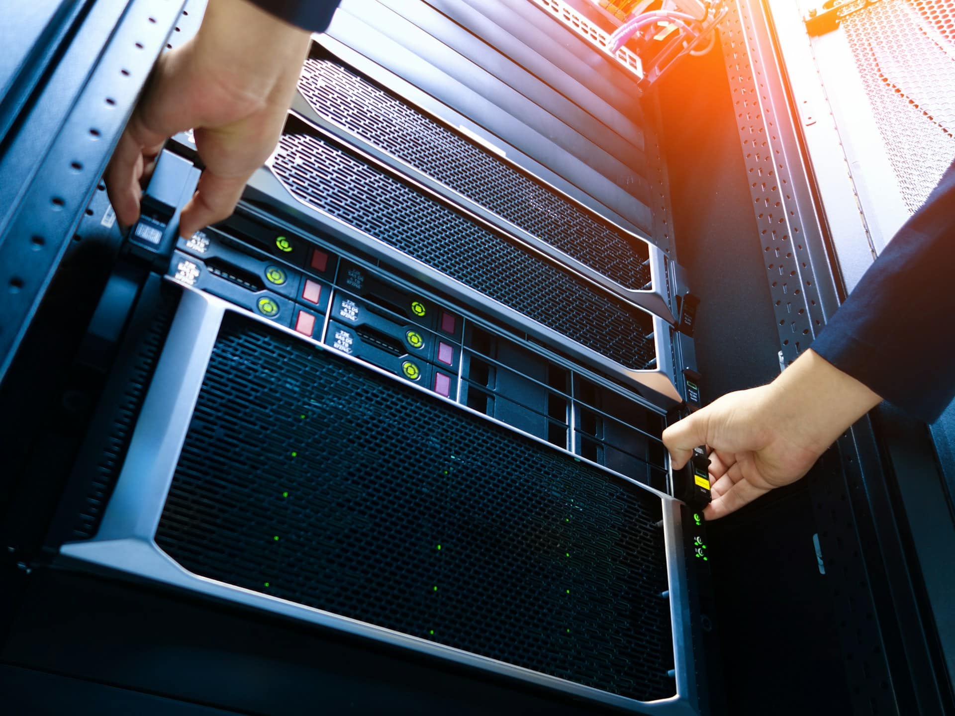 Technicians installing structured cabling and fiber optic infrastructure in a mission-critical data center environment